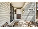Inviting entryway with decorative metal security door and covered porch at 12560 E Warren Dr # E, Aurora, CO 80014