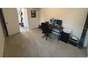 Home office with carpet and a desk setup at 15682 W Girard Ave, Morrison, CO 80465