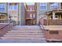 Welcoming building entrance with brick accents and stairs at 5592 S Nevada St # 306, Littleton, CO 80120