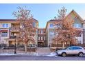 Modern building exterior with landscaping and parking at 5592 S Nevada St # 306, Littleton, CO 80120