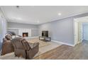 Living room with fireplace and hardwood floors at 2221 S Dearborn St, Aurora, CO 80014