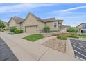 Charming home featuring an attached two-car garage, attractive landscaping, and accessible ramp for easy entry at 22124 E Euclid Dr, Aurora, CO 80016