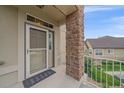 Close-up of the front door, highlighting the brick pillar, and secure entrance for a welcoming first impression at 22124 E Euclid Dr, Aurora, CO 80016