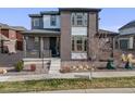 Charming two-story home featuring brick and siding, a cozy front porch, and modern landscaping at 9694 Meeker St, Littleton, CO 80125