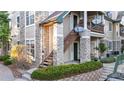 Exterior of the property showcasing stone accents and wood stairs at 4085 S Crystal Cir # 101, Aurora, CO 80014