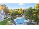 Aerial view of community pool surrounded by lush trees and well-maintained landscaping at 4085 S Crystal Cir # 101, Aurora, CO 80014
