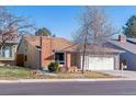 Brick ranch home with mature trees and landscaping at 12224 E Amherst Cir, Aurora, CO 80014