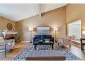 Bright living room with vaulted ceiling and fireplace at 12224 E Amherst Cir, Aurora, CO 80014