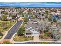 Wide aerial shot displaying the house, surrounding neighborhood, and well-maintained street at 11638 Xavier Way, Westminster, CO 80031