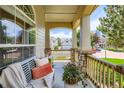Relaxing front porch with comfortable seating and a charming neighborhood view at 11638 Xavier Way, Westminster, CO 80031