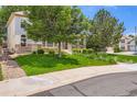 Residential house with manicured lawn, lovely landscaping, and mature shade trees in a quiet neighborhood at 11638 Xavier Way, Westminster, CO 80031