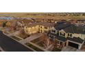 Picturesque aerial view of a neighborhood featuring a two-story home with an attached garage at 26656 E Peakview Dr, Aurora, CO 80016