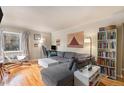 Bright living room with hardwood floors, modern furniture, and a comfortable seating area with a view at 3905 E 2Nd Ave # 2, Denver, CO 80206