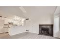 Bright living room with fireplace and vaulted ceiling at 10212 W 80Th Dr # D, Arvada, CO 80005