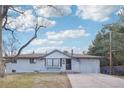 Charming single-story home with traditional design, front yard, and an attached garage at 7076 S Verbena Cir, Centennial, CO 80112