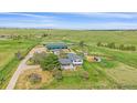Charming home exterior featuring a well-maintained lawn, mature trees, and an outbuilding in a serene setting at 9255 N Delbert Rd, Parker, CO 80138