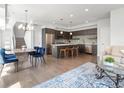 Open-concept living space showcasing a kitchen island and inviting dining area at 1568 Wolff St, Denver, CO 80204