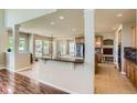 Open-concept kitchen with granite countertops and stainless steel appliances, perfect for entertaining at 23029 Cleveland Dr, Parker, CO 80138