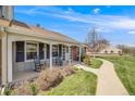 Single story home featuring a covered porch, walkway, and mature landscaping at 2757 E Geddes Ave, Centennial, CO 80122