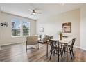 Bright and airy living room featuring stylish furnishings, modern lighting, and large windows at 17032 Blue Mist Grv, Monument, CO 80132