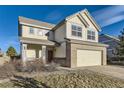 Inviting two-story house featuring a covered porch and attached two-car garage at 254 Ellendale St, Castle Rock, CO 80104