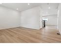 Open room with wood floors, white walls, and staircase access at 574 Penn Rd, Elizabeth, CO 80107