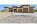 Expansive home with a large driveway and a three-car garage at 634 County Road 37, Brighton, CO 80603
