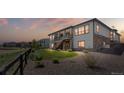 Spacious backyard featuring a patio, lush lawn, and scenic views at 22609 E Eads Cir, Aurora, CO 80016