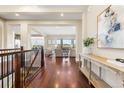Bright foyer featuring hardwood floors and an open floor plan at 22609 E Eads Cir, Aurora, CO 80016
