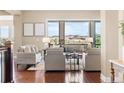 Cozy living room with large windows and comfortable seating at 22609 E Eads Cir, Aurora, CO 80016