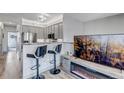 Open-concept kitchen featuring stainless steel appliances, granite countertops and bar stool seating at 837 E 98Th Ave # 403, Thornton, CO 80229