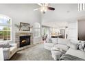 Inviting living room with a cozy fireplace and an open floor plan at 9574 Las Colinas Dr, Lone Tree, CO 80124