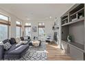 Cozy living room featuring a fireplace, built-in shelving, and plush furniture at 1080 E 13Th Ave # 301, Denver, CO 80218