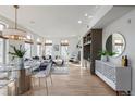 Bright living room featuring large windows, a fireplace, and stylish decor at 1080 E 13Th Ave # 301, Denver, CO 80218