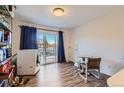 Functional laundry area with a washer, dryer, and access to an outdoor patio at 3855 S Monaco St # 209, Denver, CO 80237