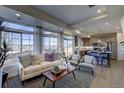 Open-concept living room seamlessly connects to the kitchen, ideal for modern living at 1200 Sugarloaf Ln, Erie, CO 80516