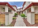Stylish home featuring a unique courtyard-style entrance and beautifully maintained landscaping at 980 S Locust St # D, Denver, CO 80224