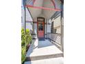 Inviting front porch featuring a charming exterior door, stylish railings, and decorative accents at 1365 Clayton St, Denver, CO 80206