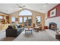 Bright living room with vaulted ceilings, fireplace, built-ins, and scenic mountain views at 156 S Lookout Mountain Rd, Golden, CO 80401