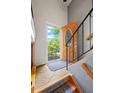 Inviting entryway features a decorative front door and staircase leading to the upper level at 1560 Findlay Way, Boulder, CO 80305