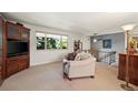 Comfortable living room showcasing a built-in entertainment unit and bright window, ideal for Gathering time at 1560 Findlay Way, Boulder, CO 80305
