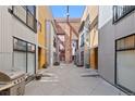Exterior view of courtyard showcasing contemporary buildings and shared outdoor space at 3225 Blake St # 8, Denver, CO 80205