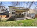 Great back yard with lawn, fence, and deck with grill and hot tub at 468 Sylvestor Trl, Highlands Ranch, CO 80129
