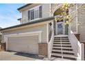 Beautiful two-story home featuring a two-car garage and an inviting entrance with stairs leading to the front door at 468 Sylvestor Trl, Highlands Ranch, CO 80129