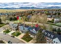 An aerial view of a residential neighborhood with mountain views and nearby hiking trails at 2225 Clayton Cir, Superior, CO 80027