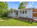 Lovely home with a well-kept yard and stone-lined garden beds at 1888 S Filbert Ct, Denver, CO 80222