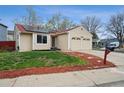 Charming single-story home featuring a well-maintained yard, solar panels, and a two-car garage at 646 S Joplin St, Aurora, CO 80017