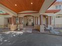 Inviting front porch with stone accents and wood columns, creating a warm and elegant entry at 2817 Keystone Dr, Evergreen, CO 80439