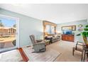 Relaxing living room with neutral walls, a plush recliner and sofa set for a comfortable and inviting space at 10321 E Evans Ave # 171, Aurora, CO 80247