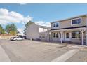 Condo exterior showcasing covered entryways, parking and tidy landscaping at 8975 Field St # 39, Broomfield, CO 80021